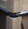 3/4" galvanized 90 degree elbow with two 6 inch nipples secured by 1/4" bolts